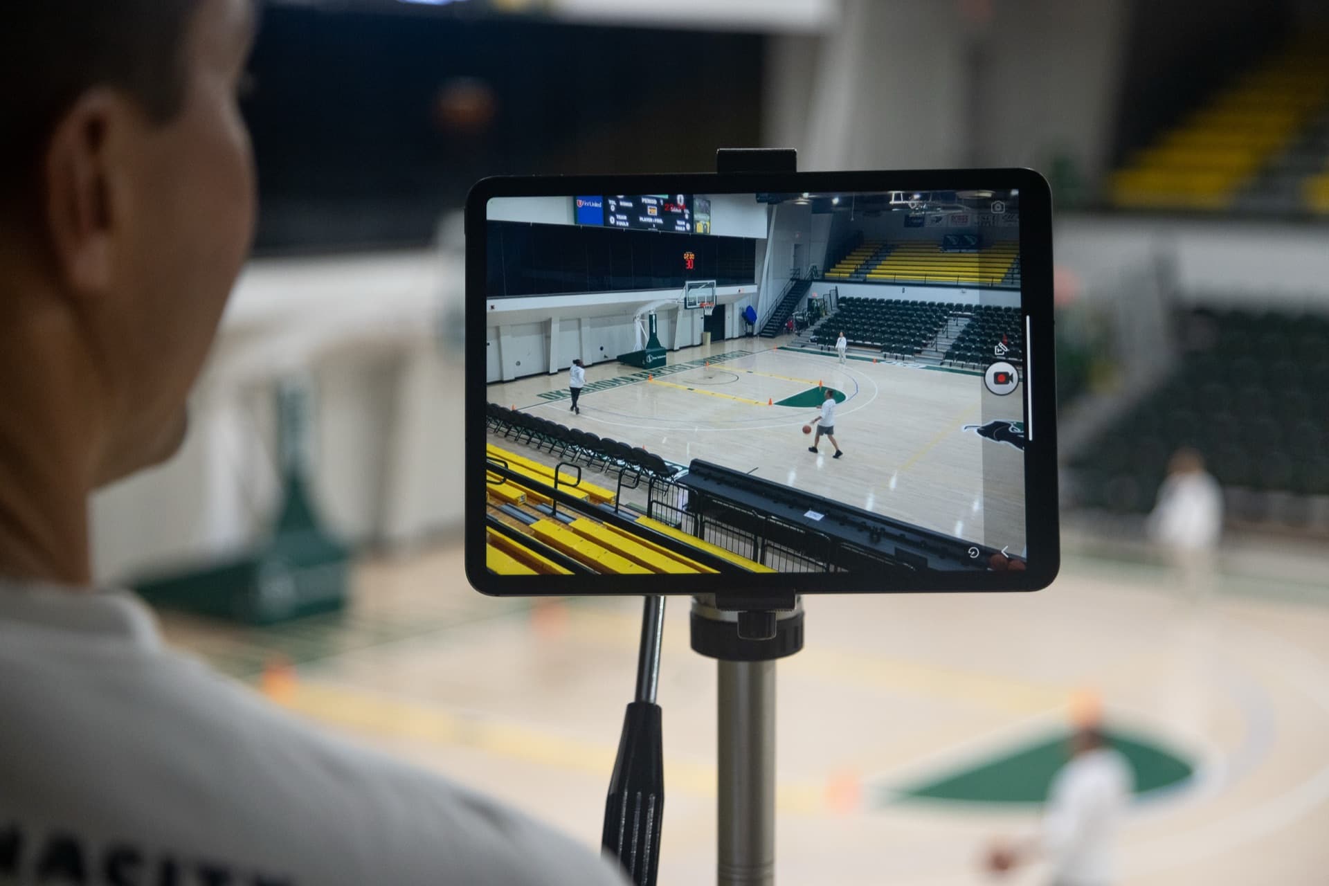 An iPad recording a live basketball game from courtside